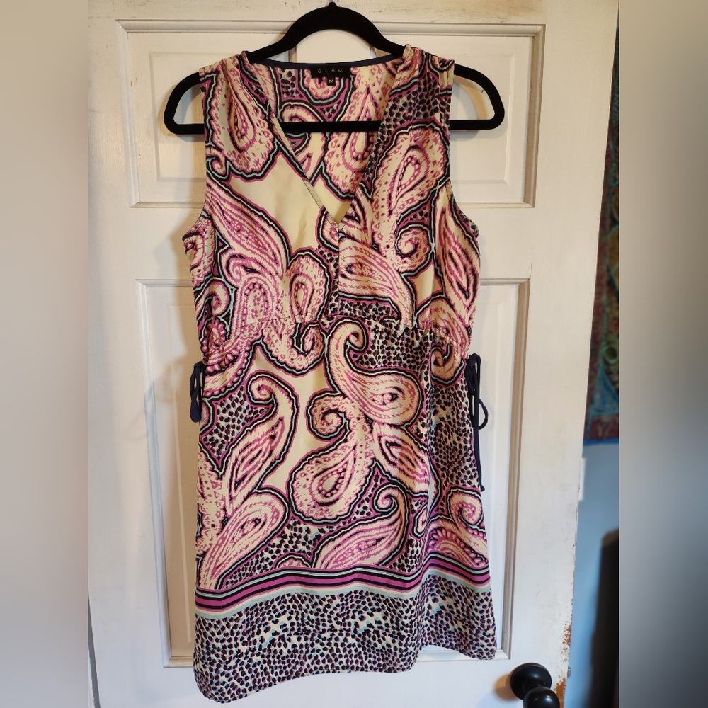 Multi colored sleeveless dress with adjustable tie waist.